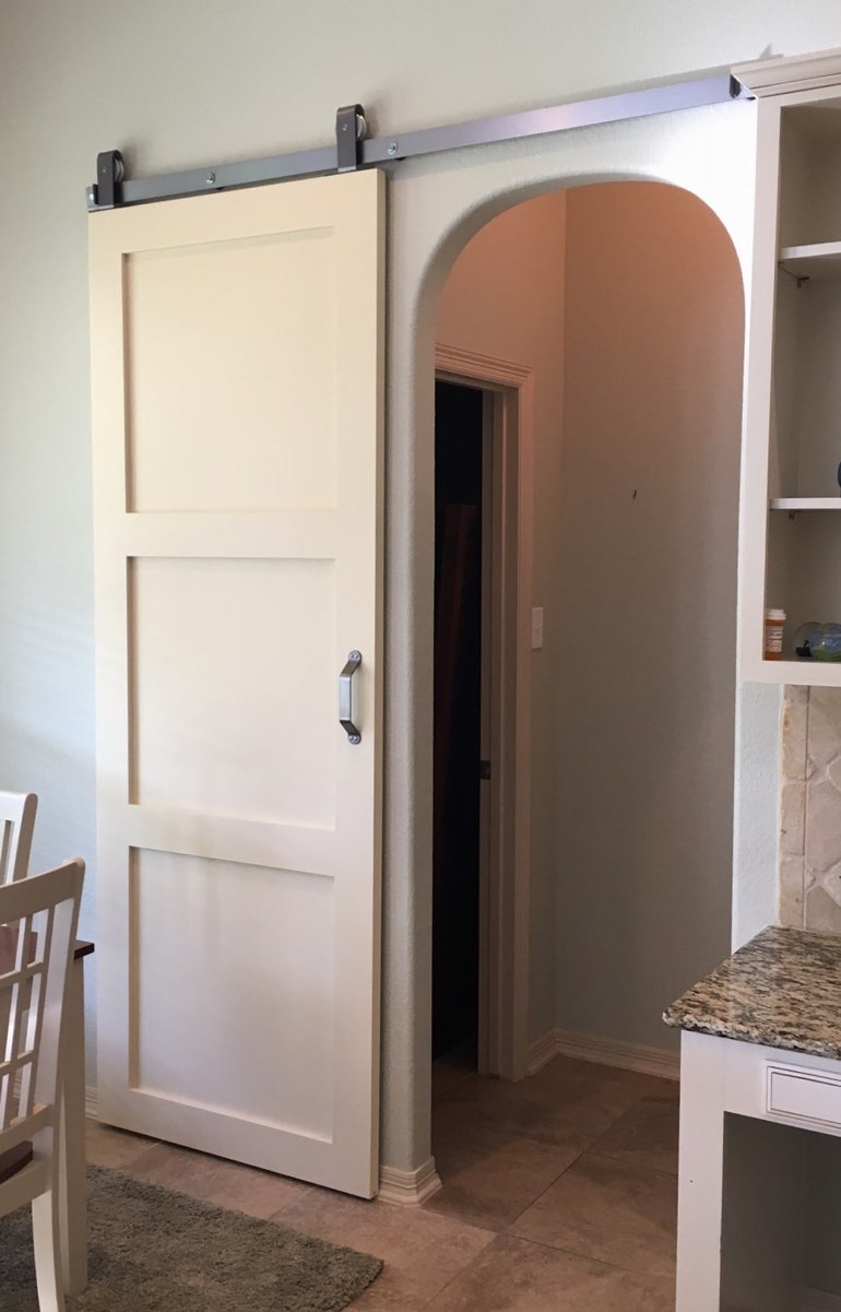 Contemporary style barn door in Dallas kitchen.